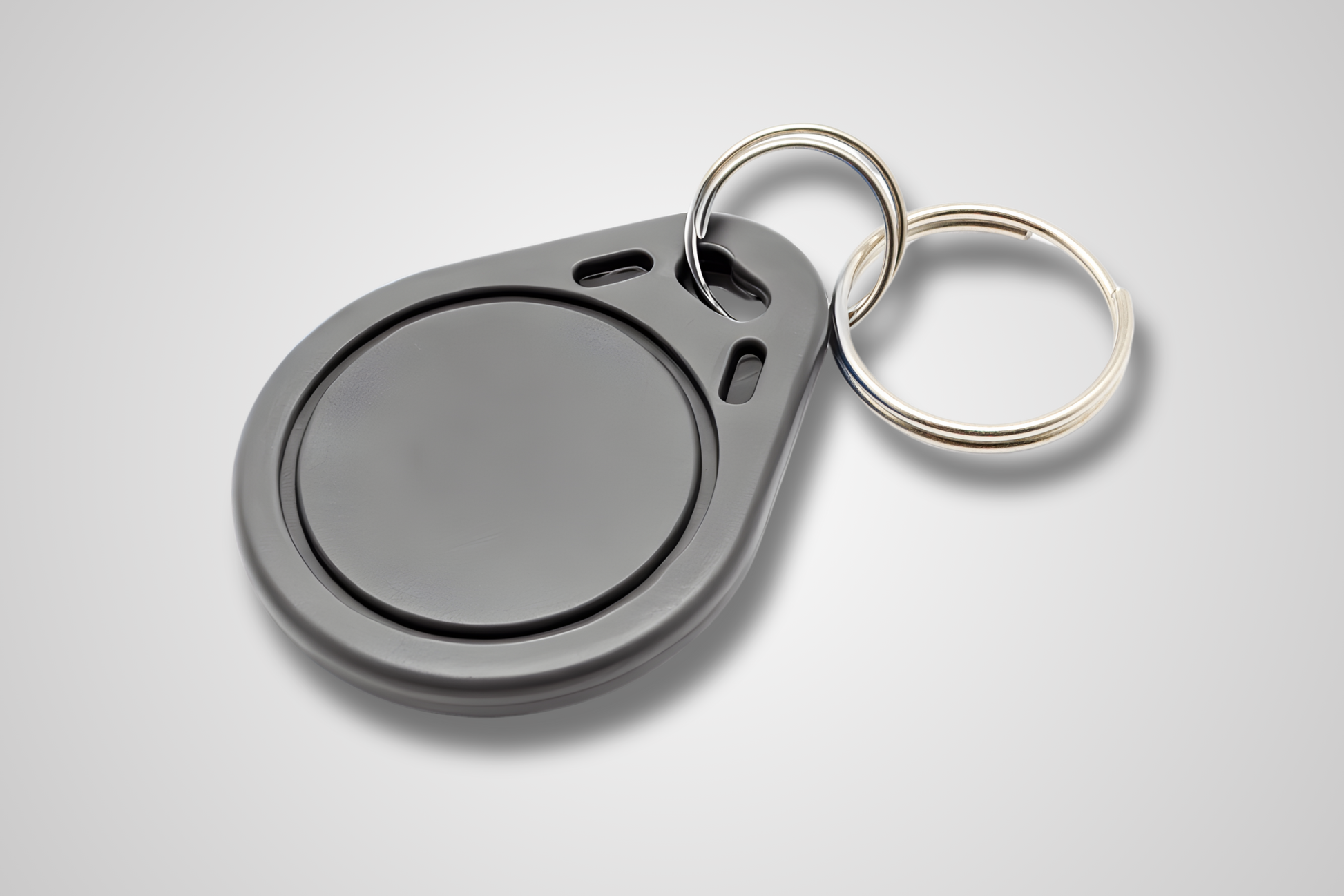 A photo of NFC Key Fob from JM Band®. Purchase RFID in grey here.